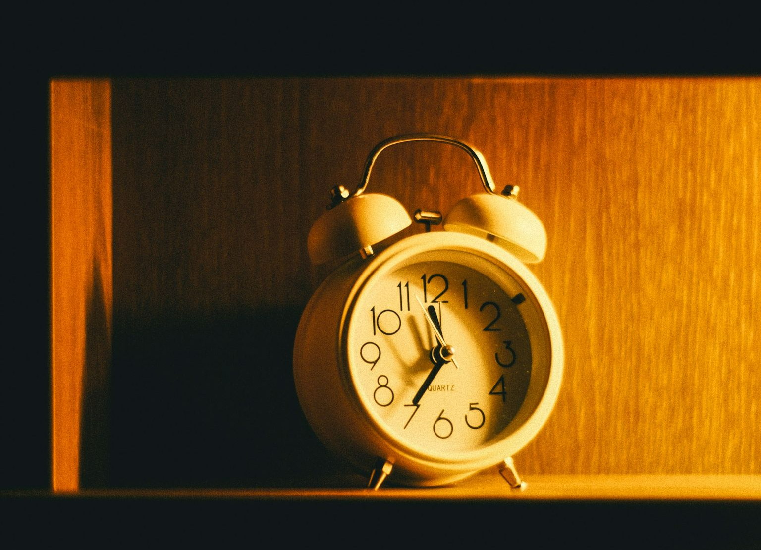 a clock on a shelf
