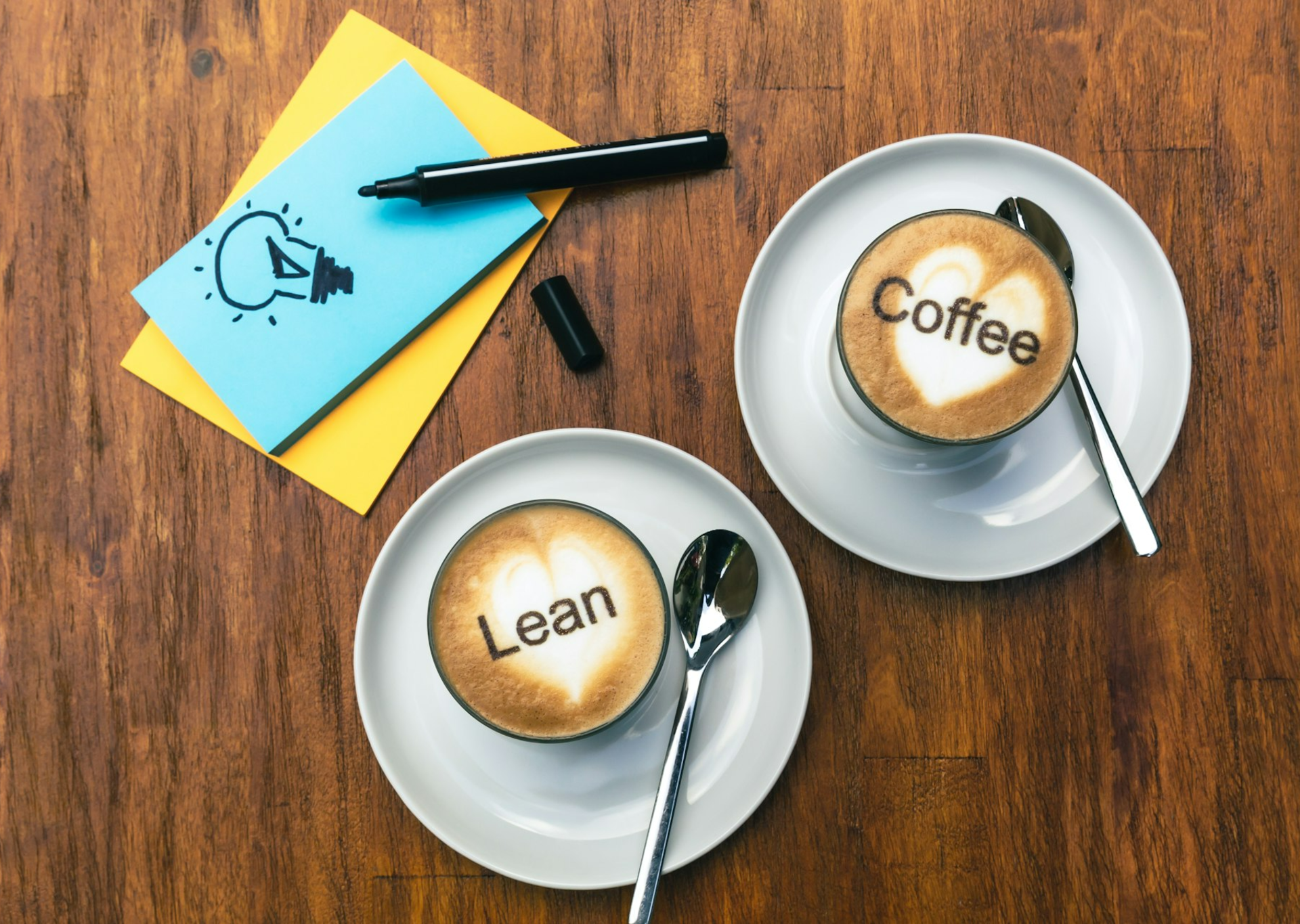 two cups of coffee with the word coffee written on them