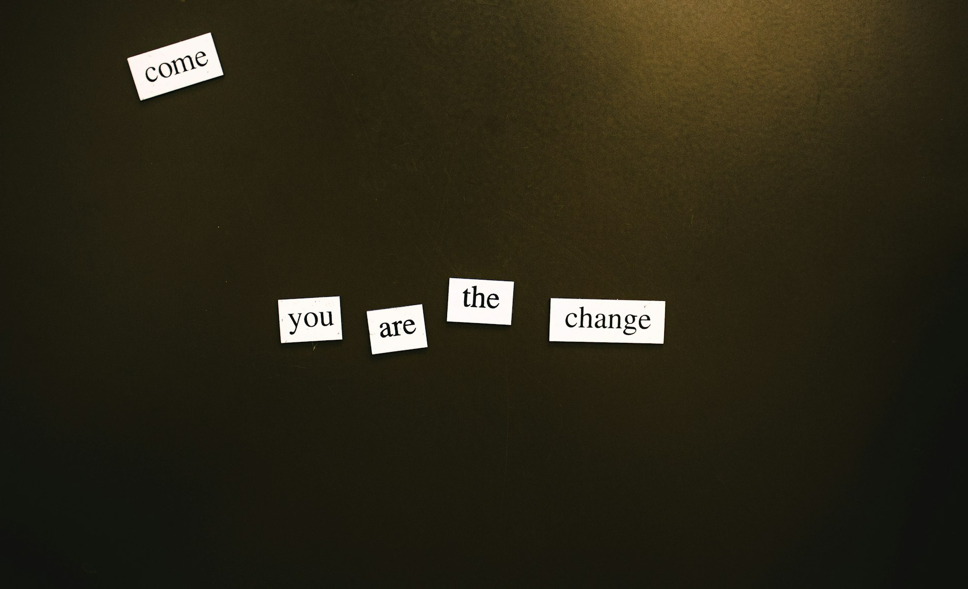 a refrigerator door with magnets that say come, the change, and come