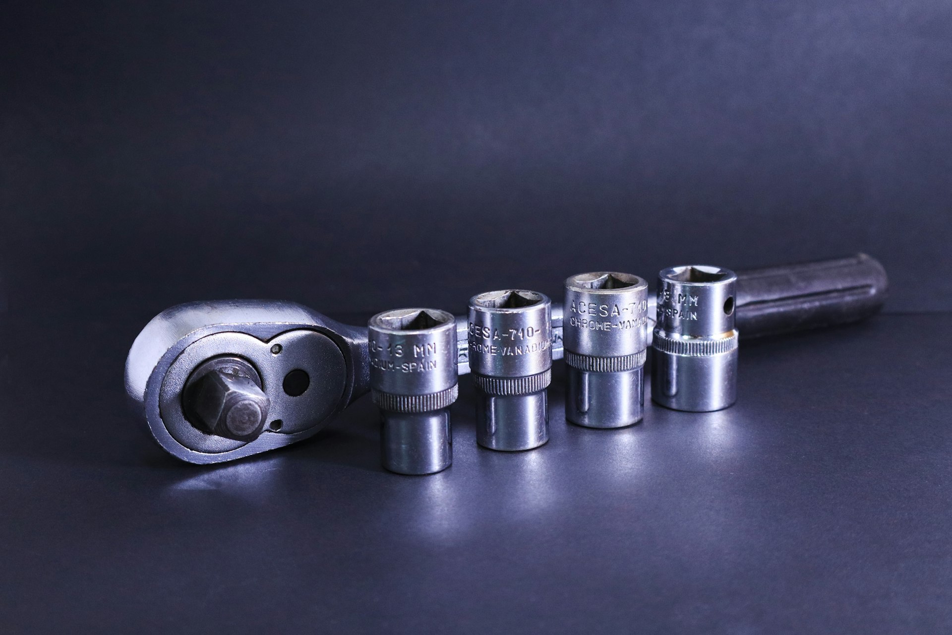 A wrench with sockets is shown.