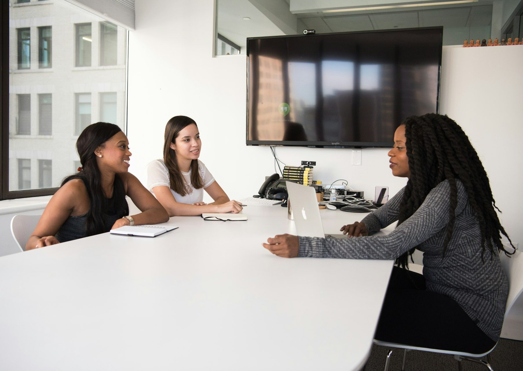 three women sitting at the table